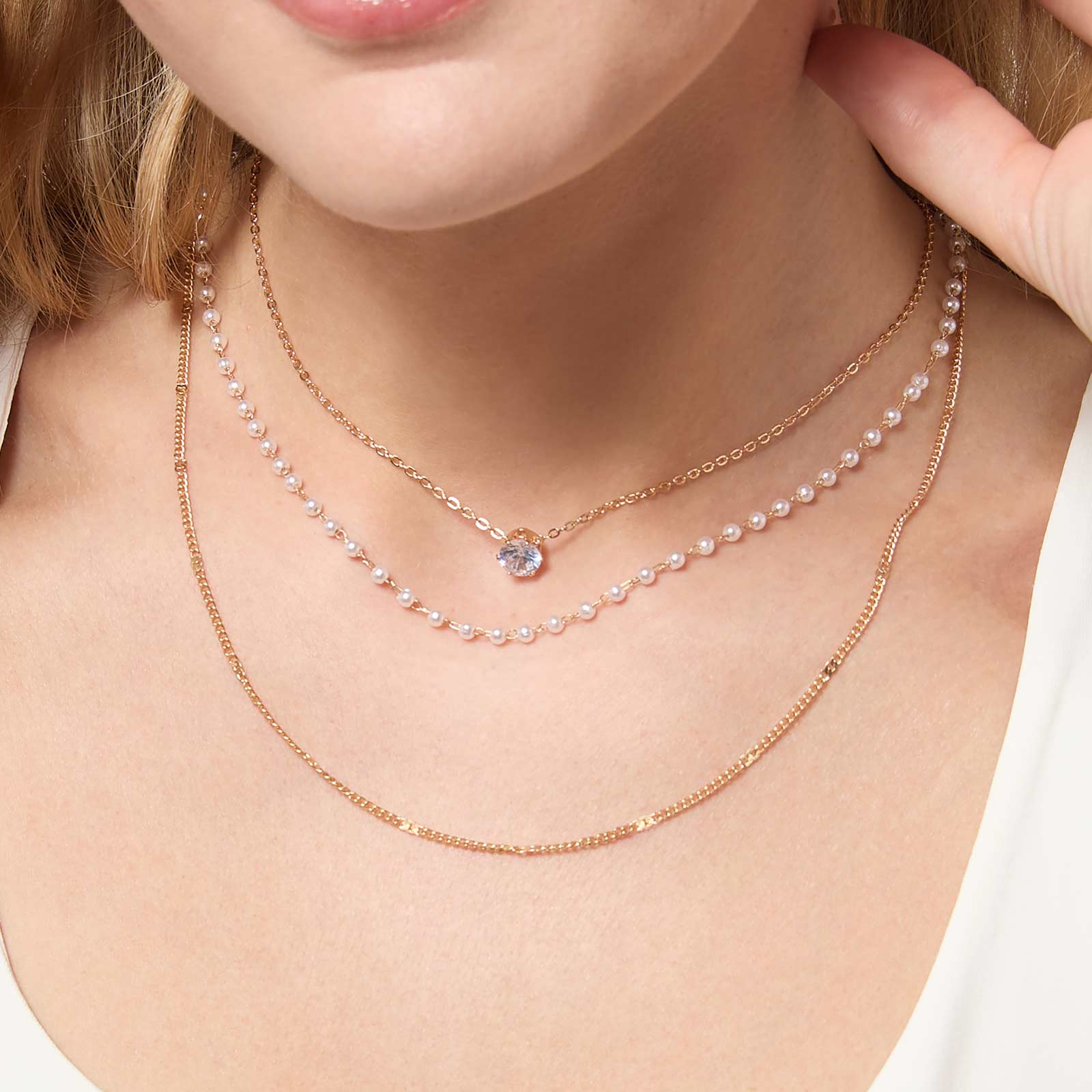 Guldfärgat halsband med tre rader