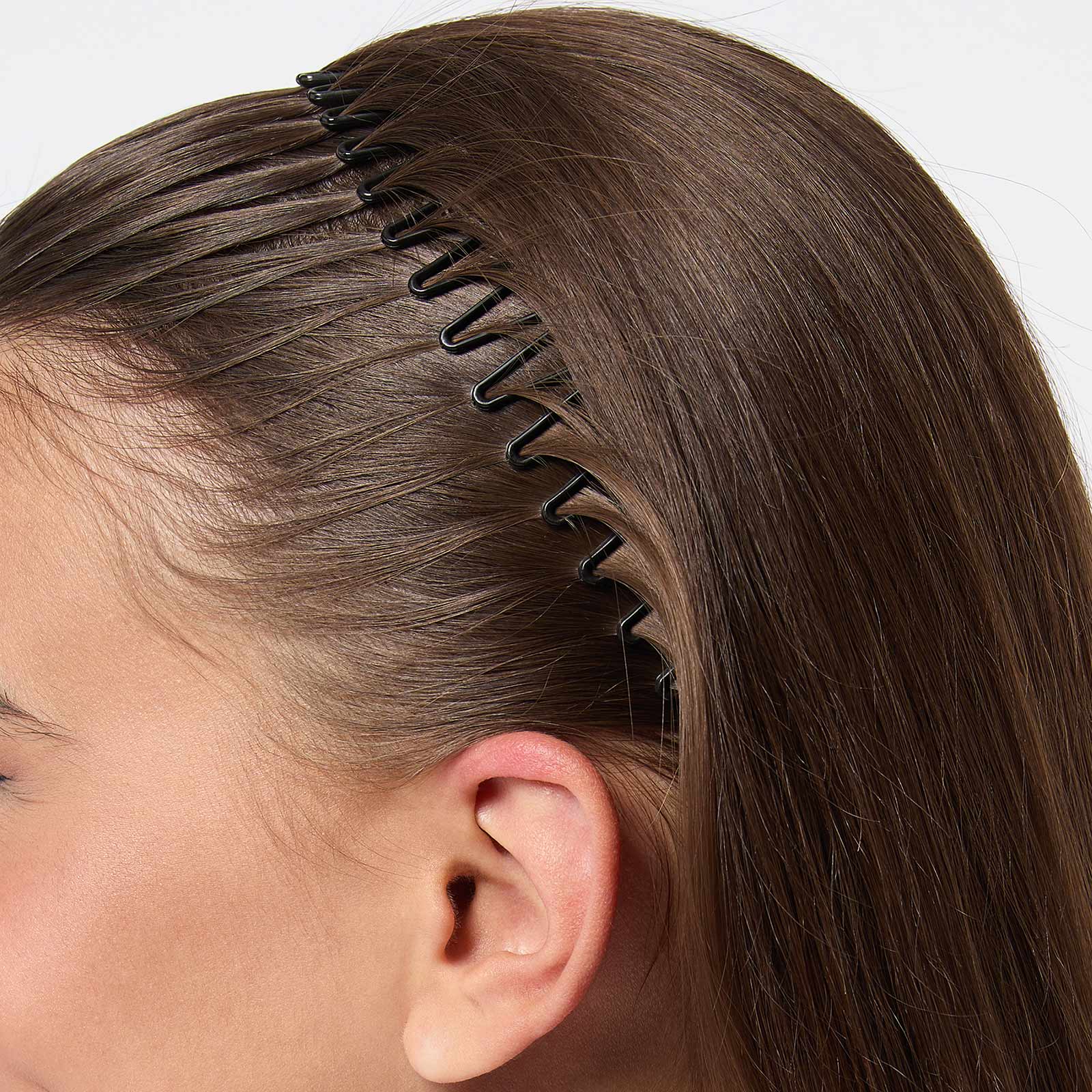 Svart flexhårband i plast