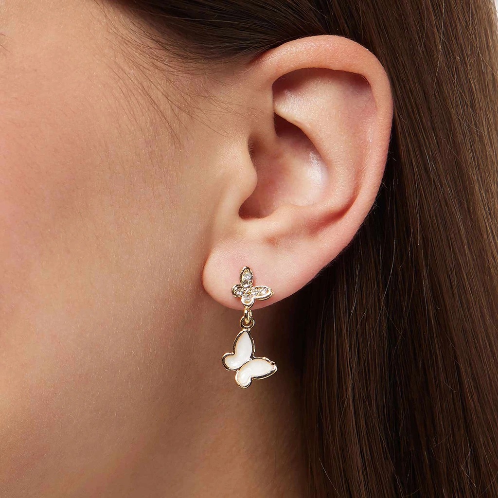 Guldfärgade örhängen - vita hängande fjärilar