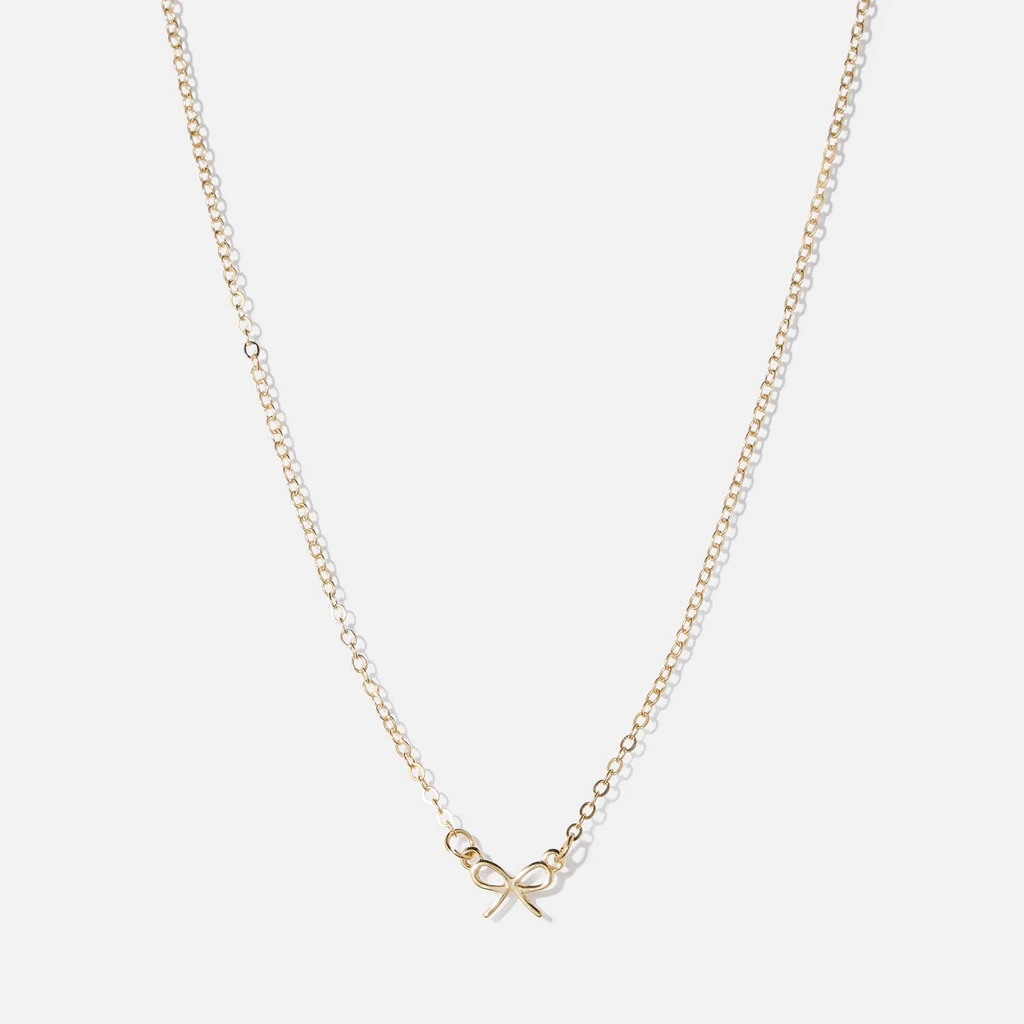 Guldfärgat halsband, sirlig rosett