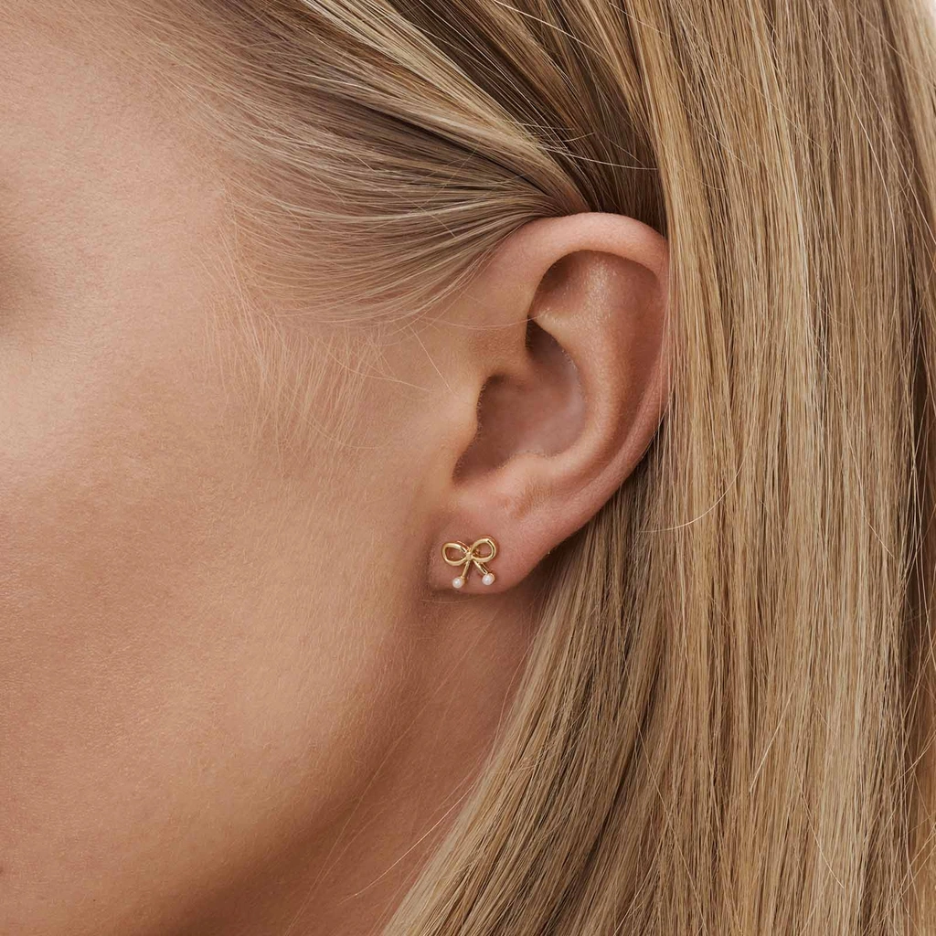 6 guldfärgade studs - olika motiv 1