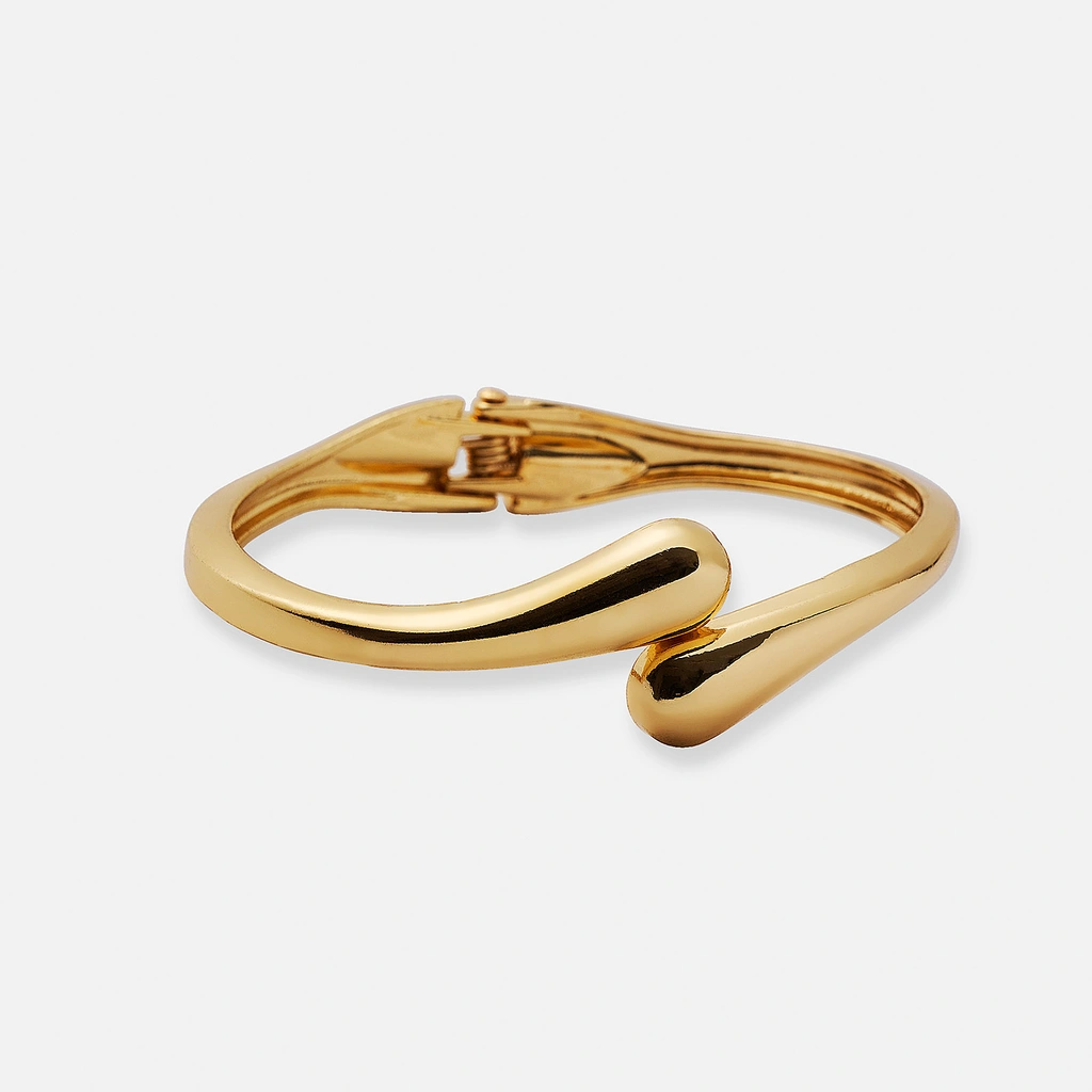 Guldfärgad bangle med rundad form - 60mm