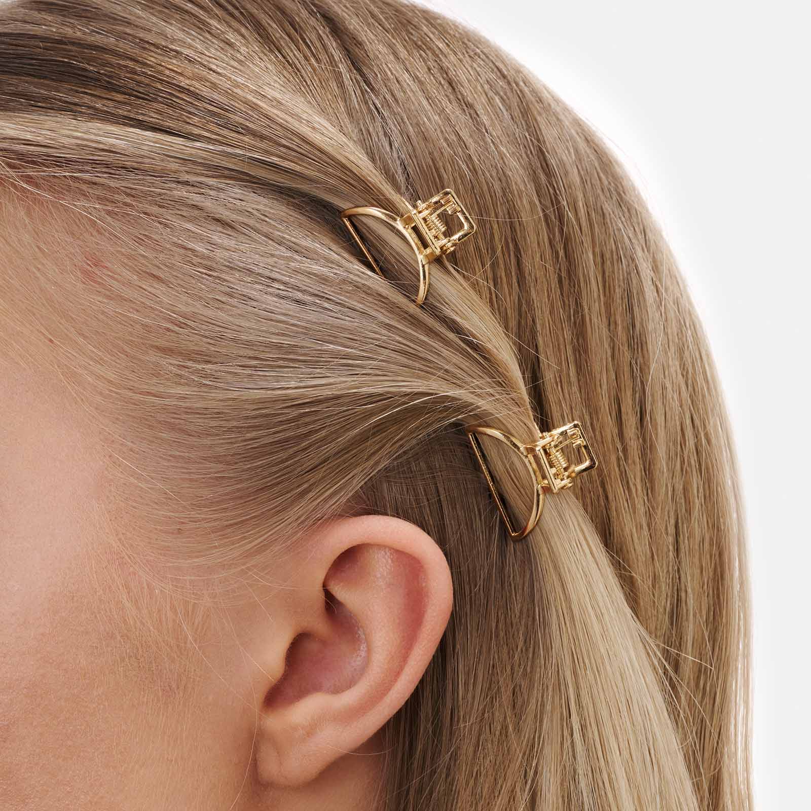2-pack guldfärgade bågformade hårklämmor, 2,5cm
