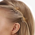 2-pack guldfärgade mini hårklämmor, 2cm