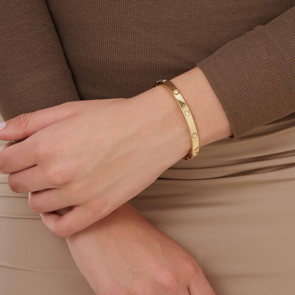 Guldfärgad bangle med vita stenar - 60mm