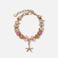 Guldfärgat armband, rosa detaljer & sjöstjärna - 18+5 cm