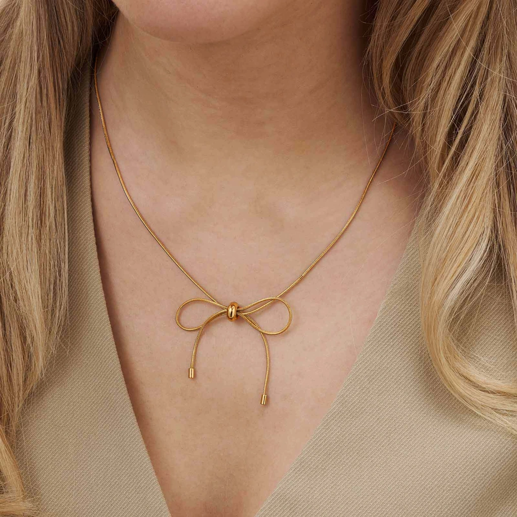 Guldfärgat halsband, ormkedja m rosett, 43+7cm