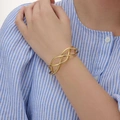 Silverpläterat vridet armband, bangle