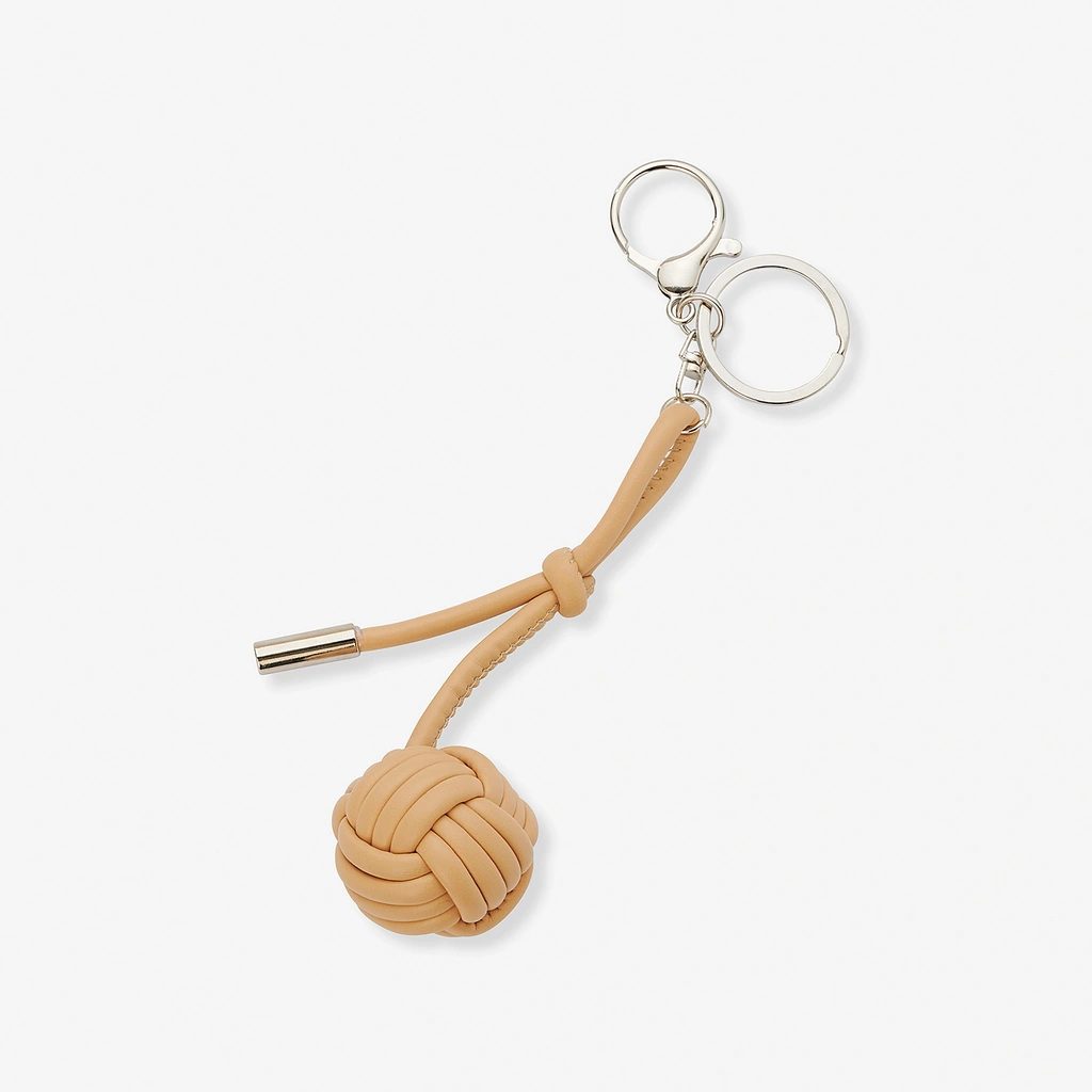 Väskaccessoar - beige knop