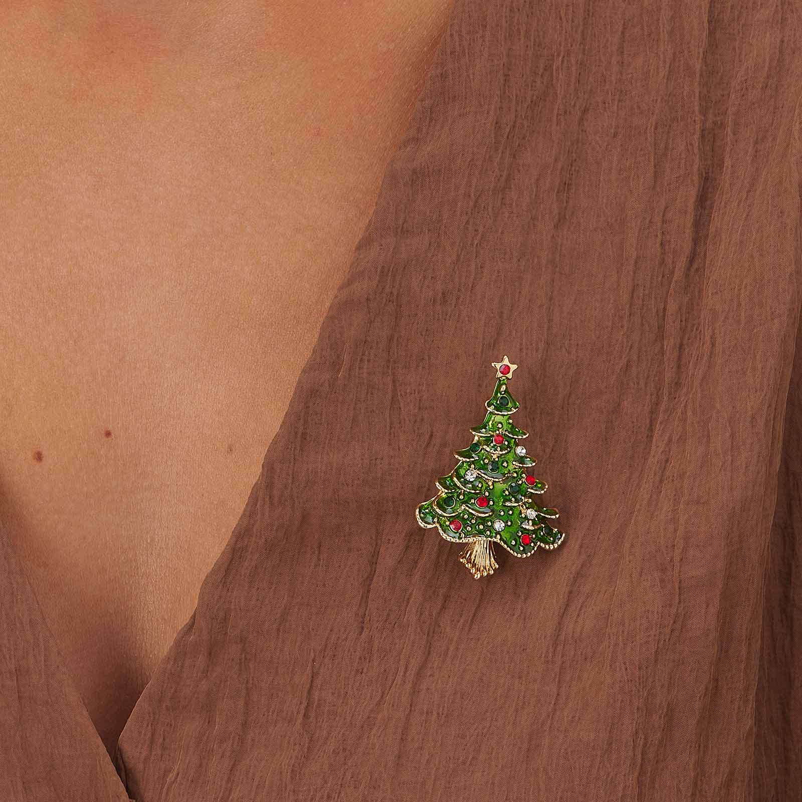 Julbrosch grön gran med stenar