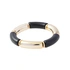 Guldfärgat armband, böjda rör i svart och guld - Justerbar
