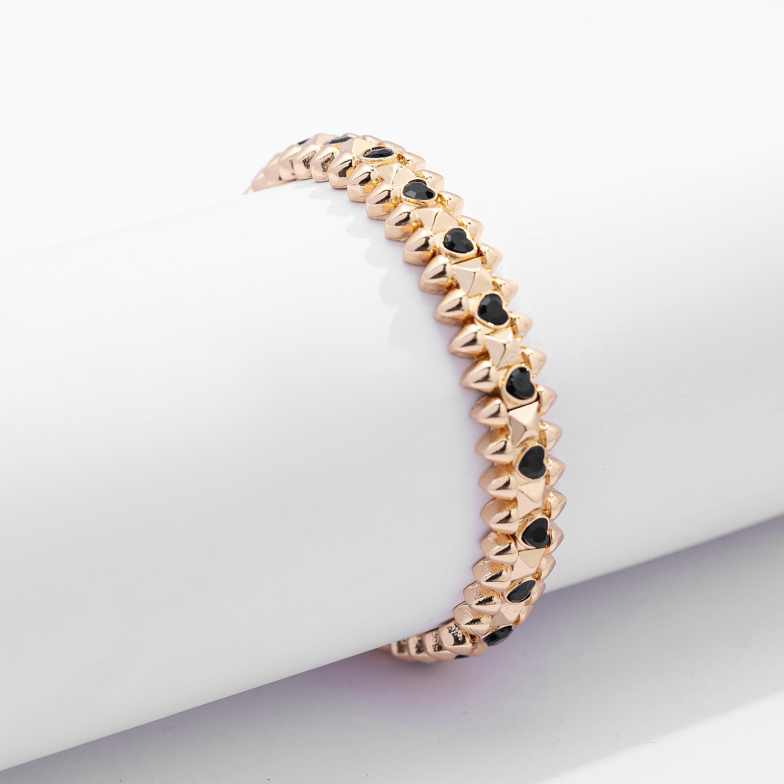 Guldfärgat armband Spike Noir, svarta hjärtan - Elastiskt
